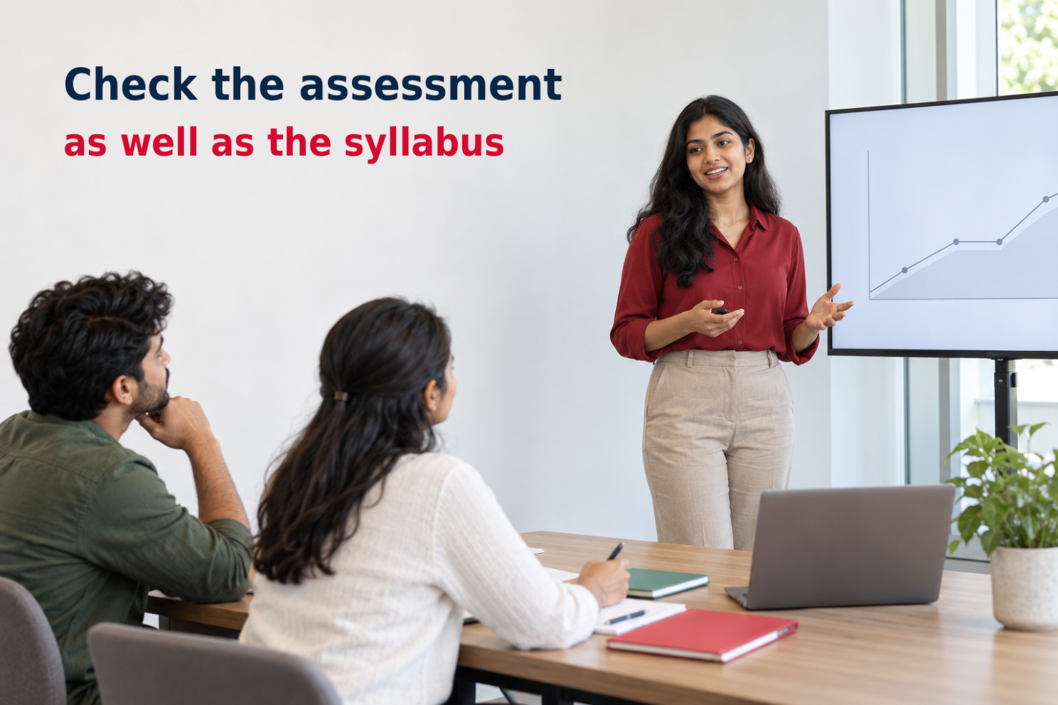 A fictional adult postgraduate learner practises presenting to two peers in a seminar room, illustrating one possible assessment method.